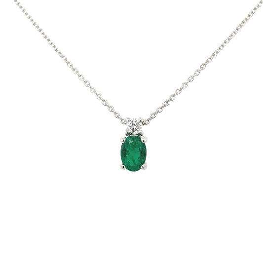 One oval green emerald and brilliant cut diamond drop pendant on trace chain.