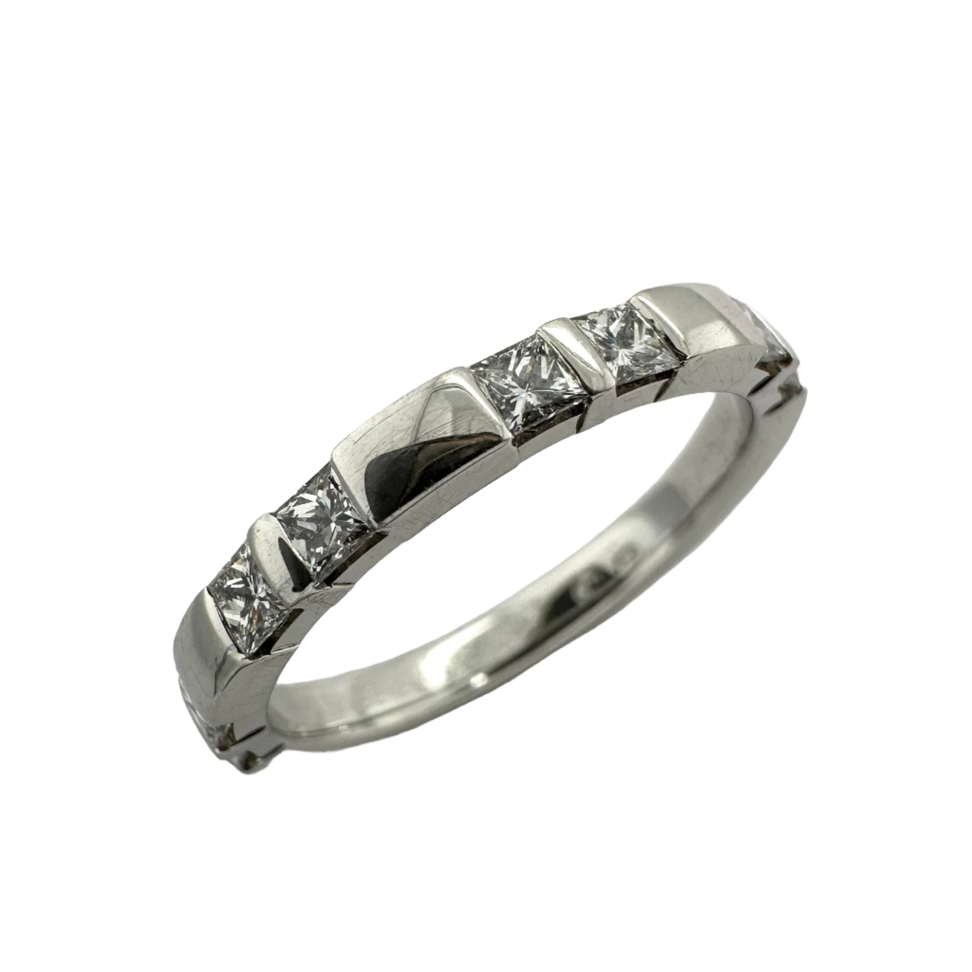  Platinum wedding ring with princess cut diamonds.