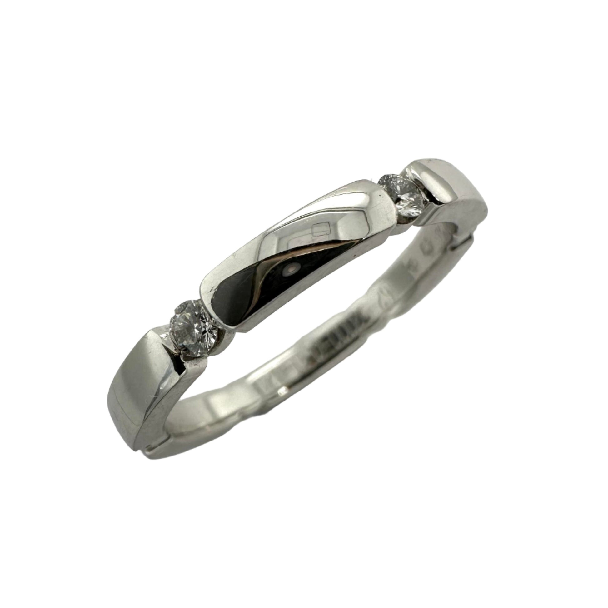 Contemporary tension set diamond wedding band in white gold. Henry D Johnstone Jewellers. Alderley Edge, Poynton, Cheshire.