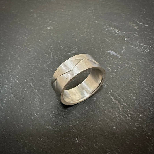 00016679 Pre-owned: One platinum 8mm 'Origami' flat band furrer Jacot ring.