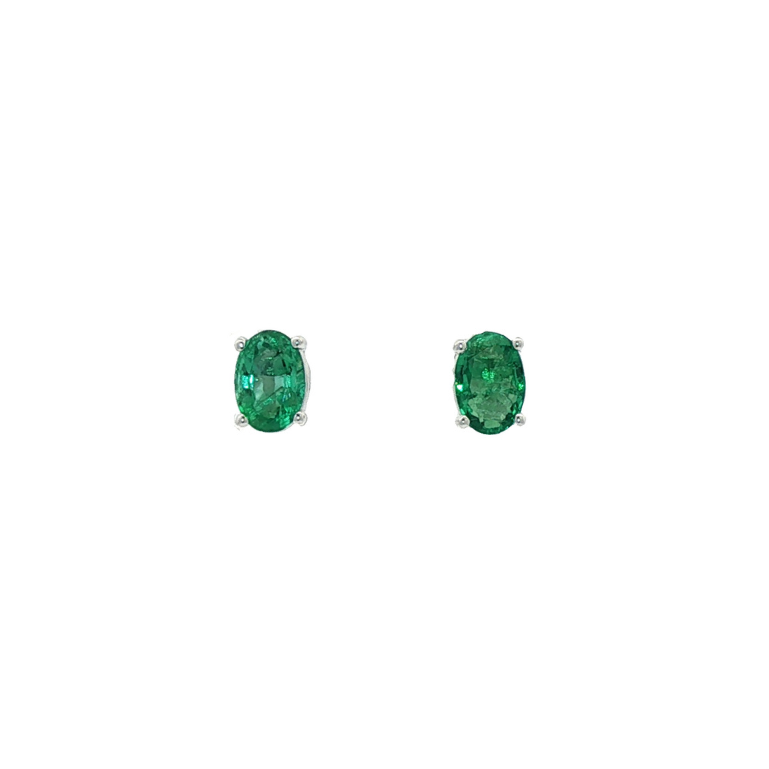 One Pair Of 9ct White Gold Faceted Oval Emerald Studs.