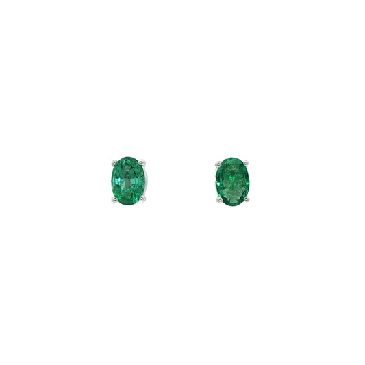 One Pair Of 9ct White Gold Faceted Oval Emerald Studs.