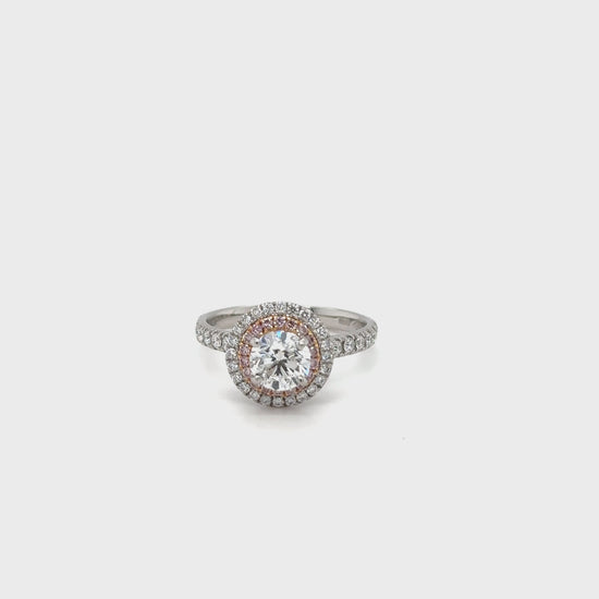 Platinum & 18ct rose gold double halo diamond set ring.