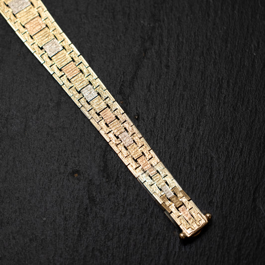Pre Owned: Three colour precious metal fine bark finish graduated bar linked bracelet.