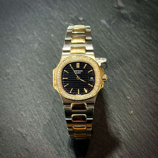 Pre-Owned: Precious yellow metal and stainless steel Patek Phillipe 28mm 'Nautilus' bracelet watch.