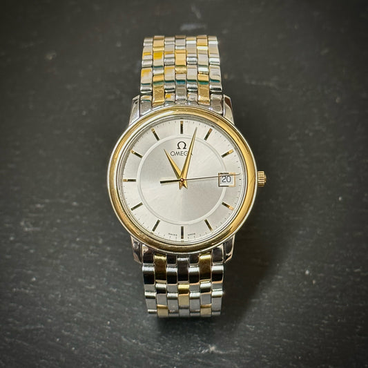 Pre-Owned: Stainless steel and precious yellow metal Omega 34mm 'DeVille' quartz bracelet watch.