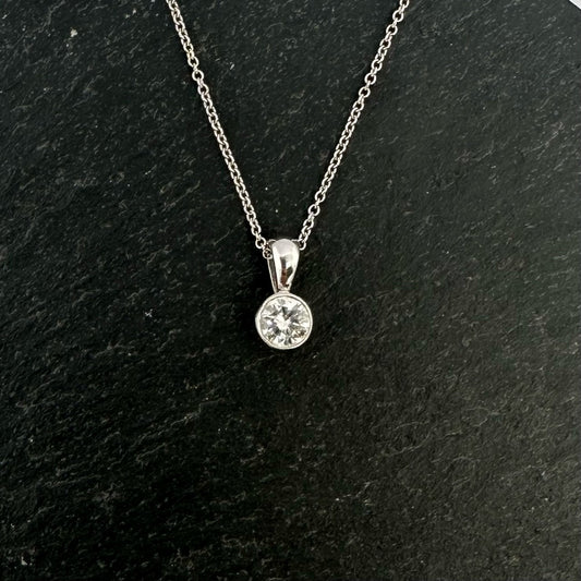 Pre-Owned: One platinum round brilliant cut diamond solitaire pendant - 0.30ct.