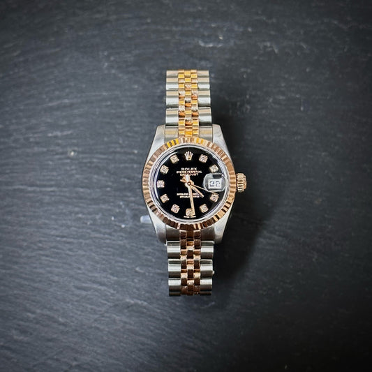 Pre-Owned: Stainless steel and precious rose metal Rolex 26mm 179171 'DateJust' bracelet watch.